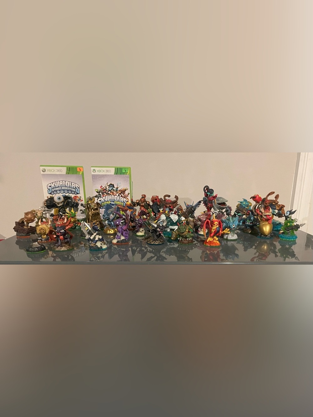 50 Skylander Figurines and 2-Xbox 360 games Lot